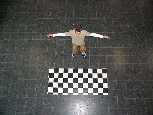 Two of the nine view photographs that were used as input for the visual hull shader. The checkerboard target is used for determining the camera calibration parameters. An image resolution of 1024x768 pixel was used.